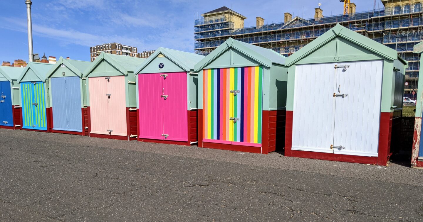 colourful wooden beach huts along hove seafront